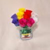 Bouquet of varied colored roses in glass vase