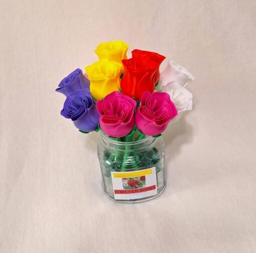 Bouquet of varied colored roses in glass vase