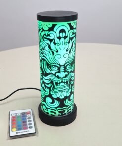 Image of dragon face on a cylindrical lamp