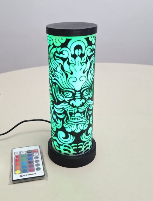 Image of dragon face on a cylindrical lamp
