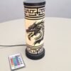Black dragon with gold face on a cylindrical lamp