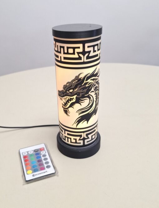 Black dragon with gold face on a cylindrical lamp