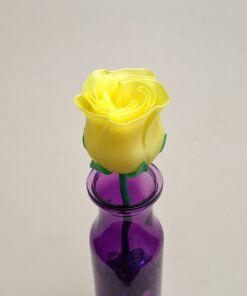 Small Yellow Rose in purple vase